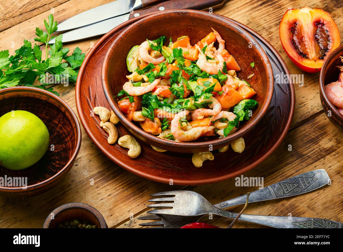 Fresh salad with tamarillo,avocado,shrimp and nuts.Prawn salad with