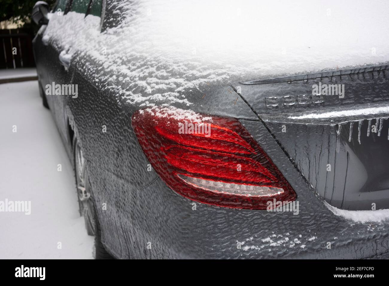 Closeup of a frozen Mercedes-Benz E300 sedan in a parking lot in Lake Oswego, Oregon, on February 13, 2021, after snow and freezing rain. Stock Photo