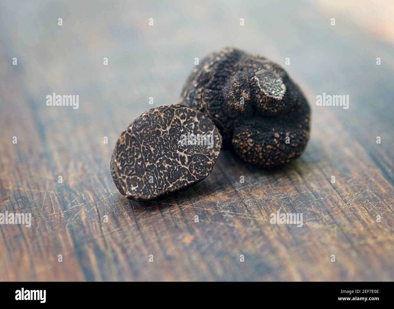 Truffles on a wooden background Stock Photo