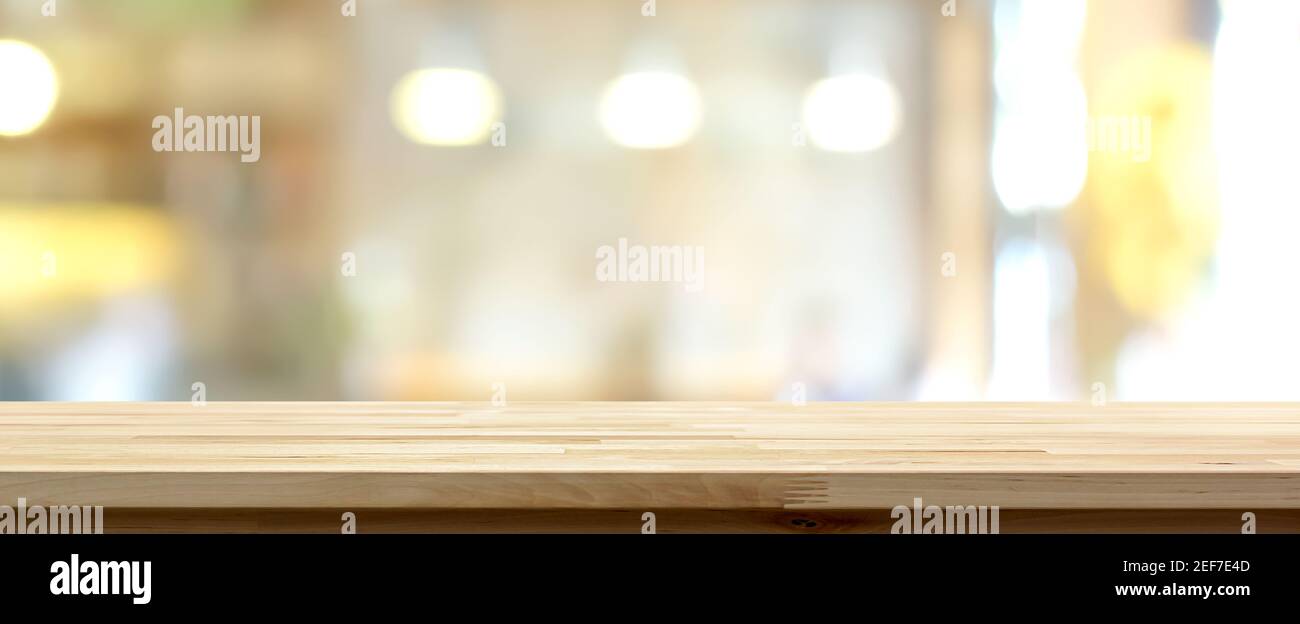Wood table top on blur restaurant interior background, panoramic banner - can be used for display your products (or food) Stock Photo