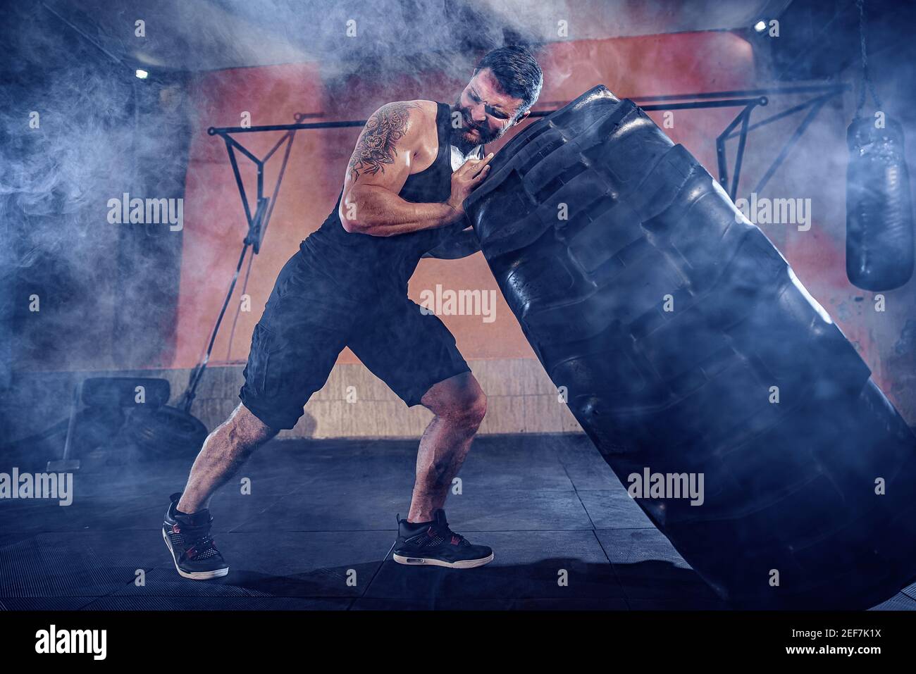 Bodybuilding training, bearded strong sportsman with muscular body