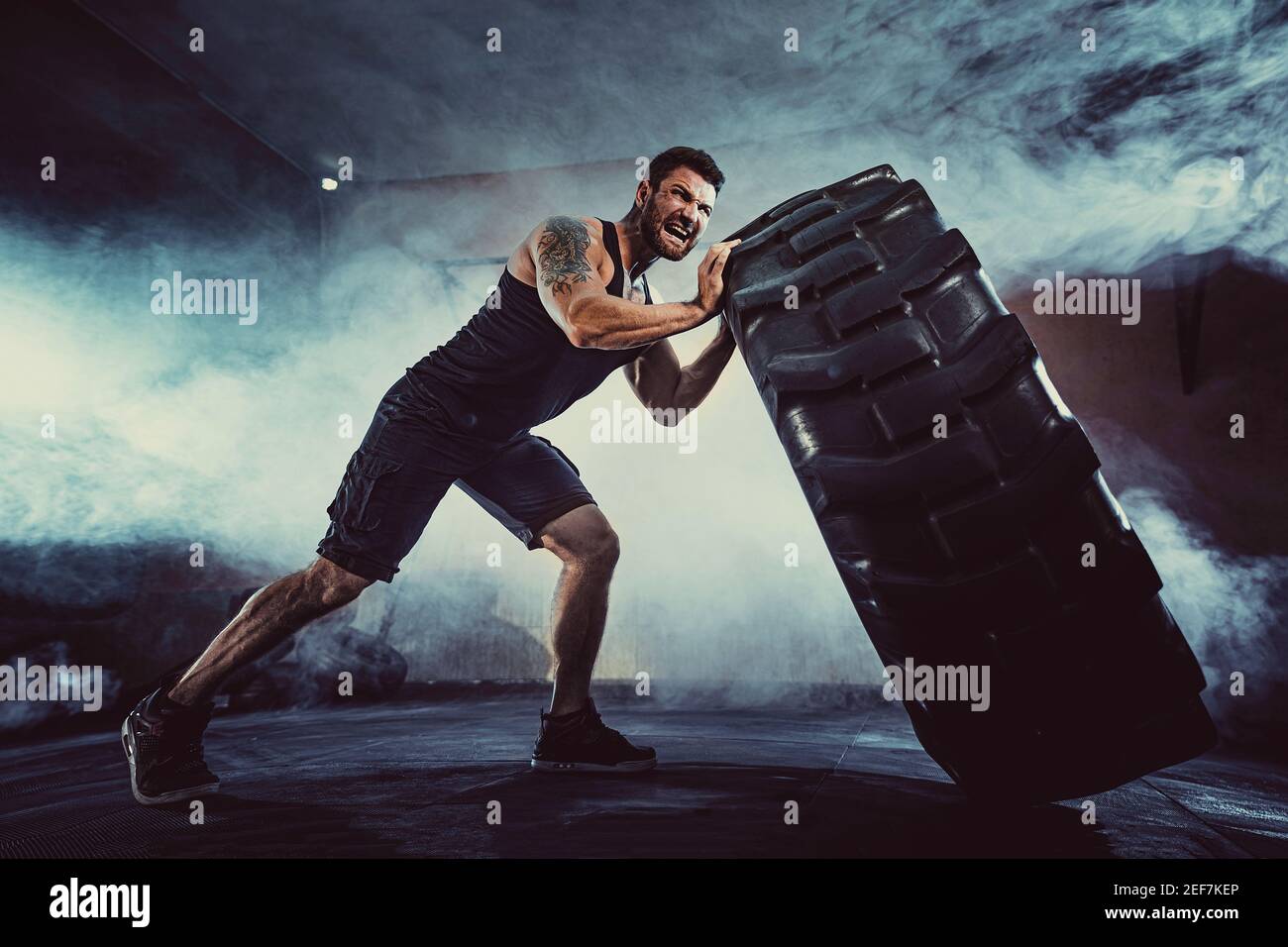 Bodybuilding training, bearded strong sportsman with muscular body