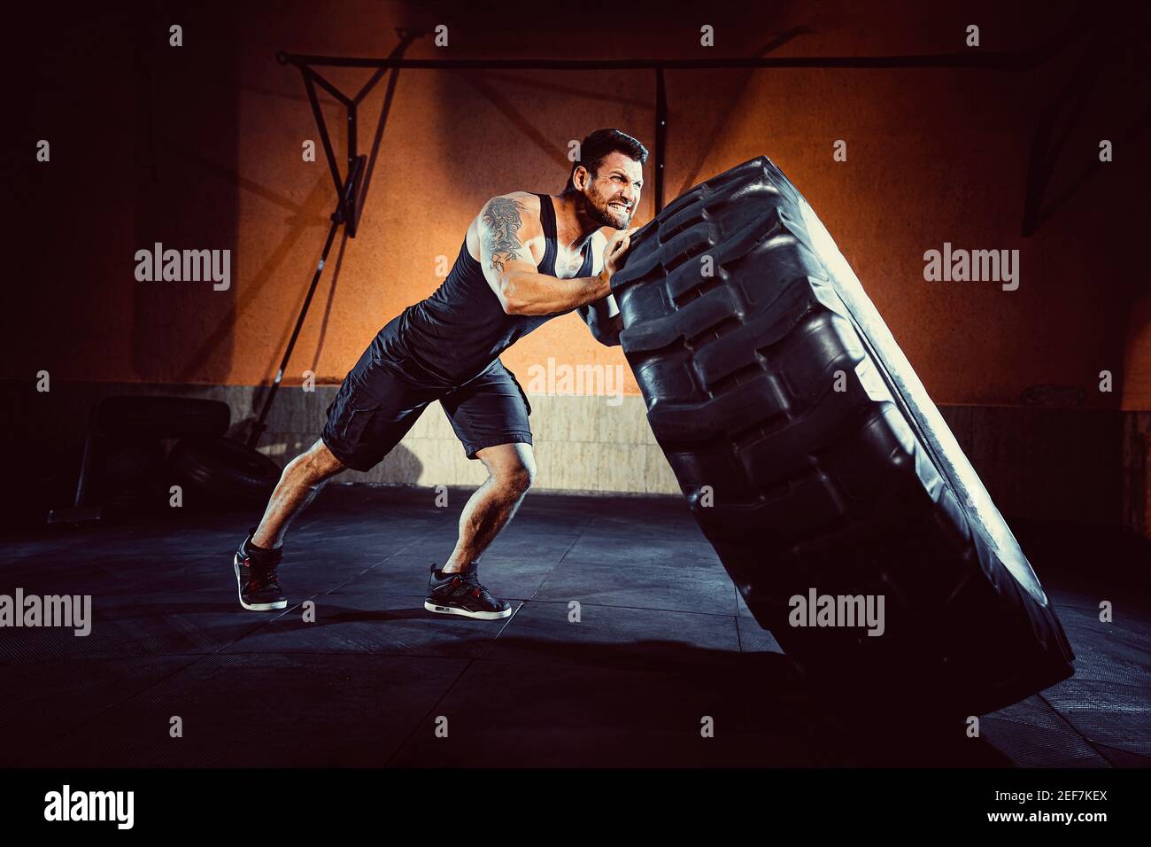 Bodybuilding training, bearded strong sportsman with muscular body