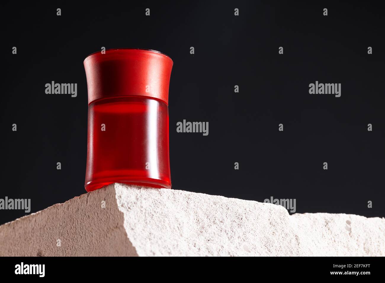 Bottle of perfume on cinder block close up Stock Photo Alamy