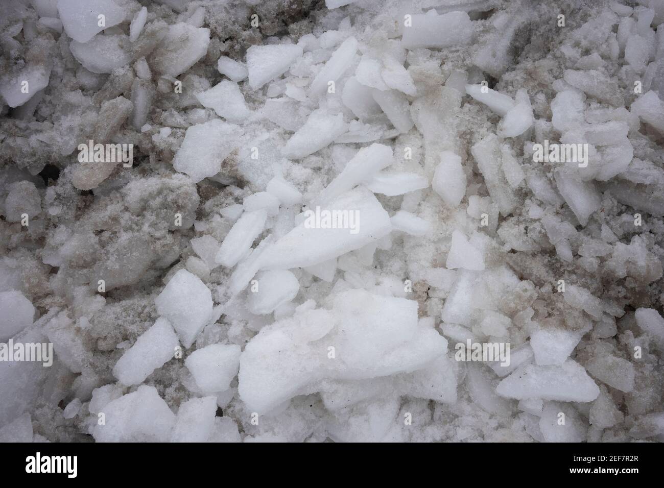 Close up of dirty ice and snow removed and piled up by the roadside Stock Photo Alamy