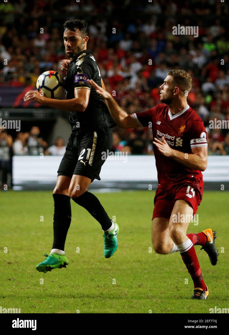 Soccer Football - Leicester City v Liverpool - Pre Season Friendly - The Premier League Asia Trophy - Final - June 22, 2017   Liverpool's Jordan Henderson in action with Leicester City's Iborra    REUTERS/BOBBY YIP Stock Photo