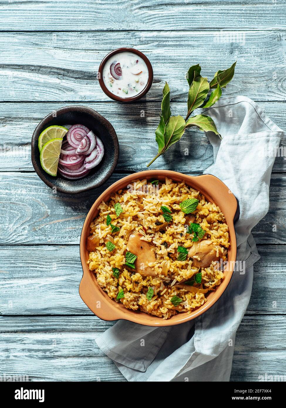 Pakistani food - biryani rice with chicken and raita yoghurt dip ...