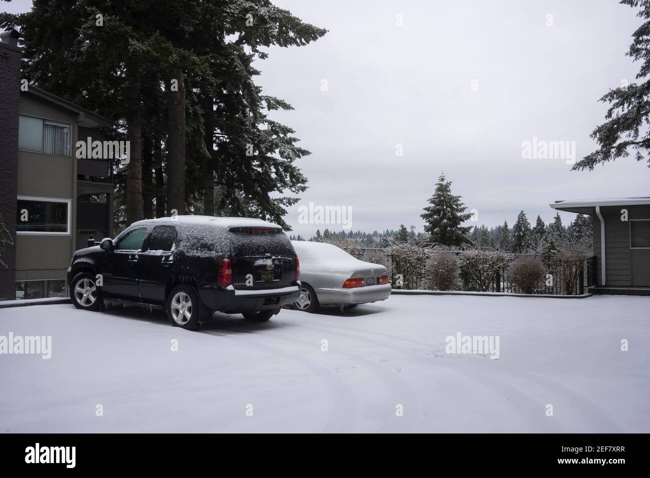 A neighborhood parking lot in Lake Oswego, Oregon, on a snowy day. Stock Photo