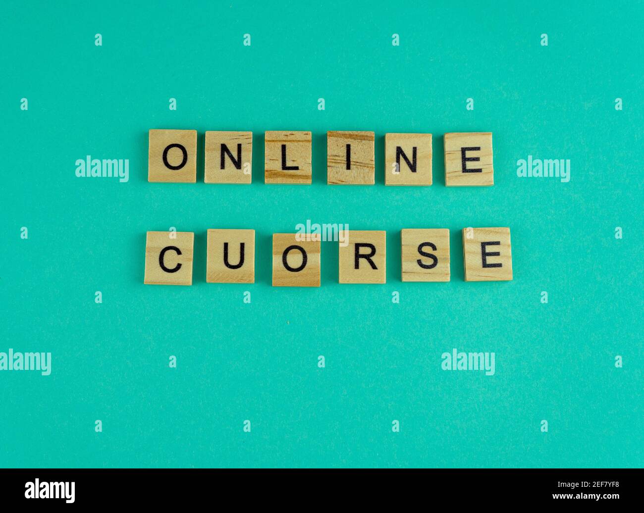 Word online course. The phrase is laid out in wooden letters. Top view. Motivation. Blue background. Copy space Stock Photo