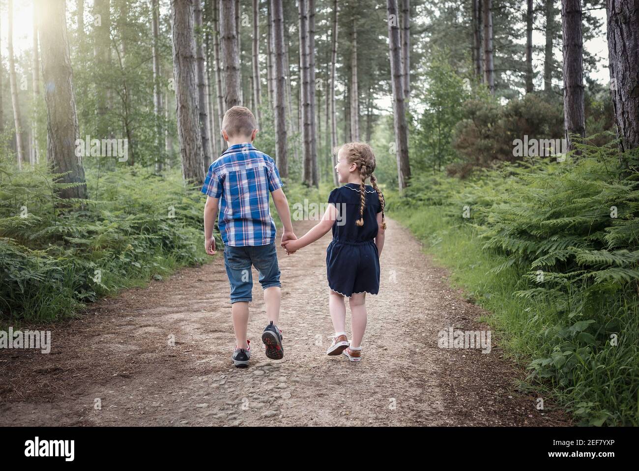 Girl boy holding hands hi-res stock photography and images - Alamy