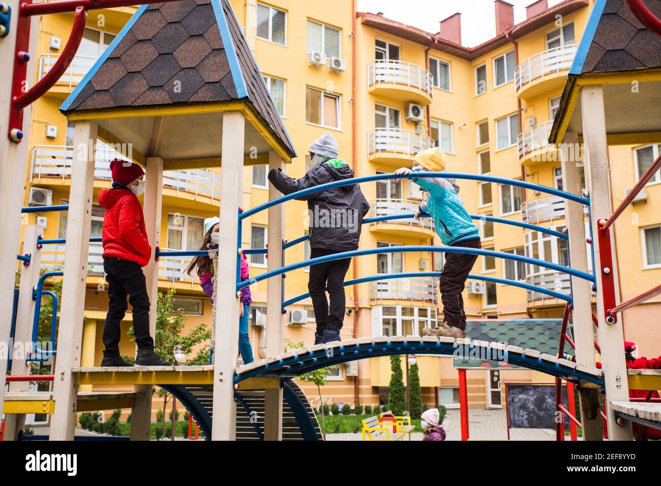 The friends meet on the playground during a pandemic Stock Photo