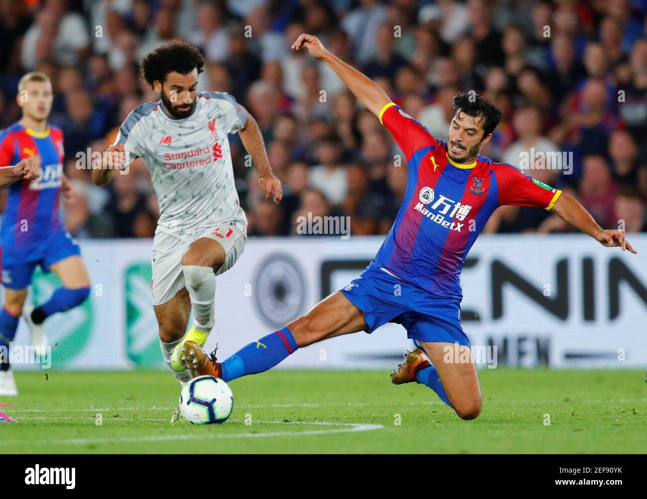 Soccer Football - Premier League - Crystal Palace v Liverpool - Selhurst Park, London, Britain - August 20, 2018 Liverpool's Mohamed Salah in action with Crystal Palace's James Tomkins REUTERS/Eddie Keogh EDITORIAL USE ONLY. No use with unauthorized audio, video, data, fixture lists, club/league logos or "live" services. Online in-match use limited to 75 images, no video emulation. No use in betting, games or single club/league/player publications. Please contact your account representative for further details. Stock Photo