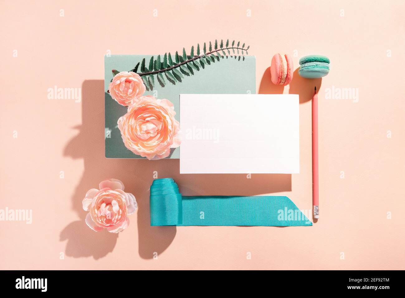 Festive mockup composition for greeting invitation, greeting card with flowers pastel colors, sunny shadows Congratulations on Women's Day and birthda Stock Photo