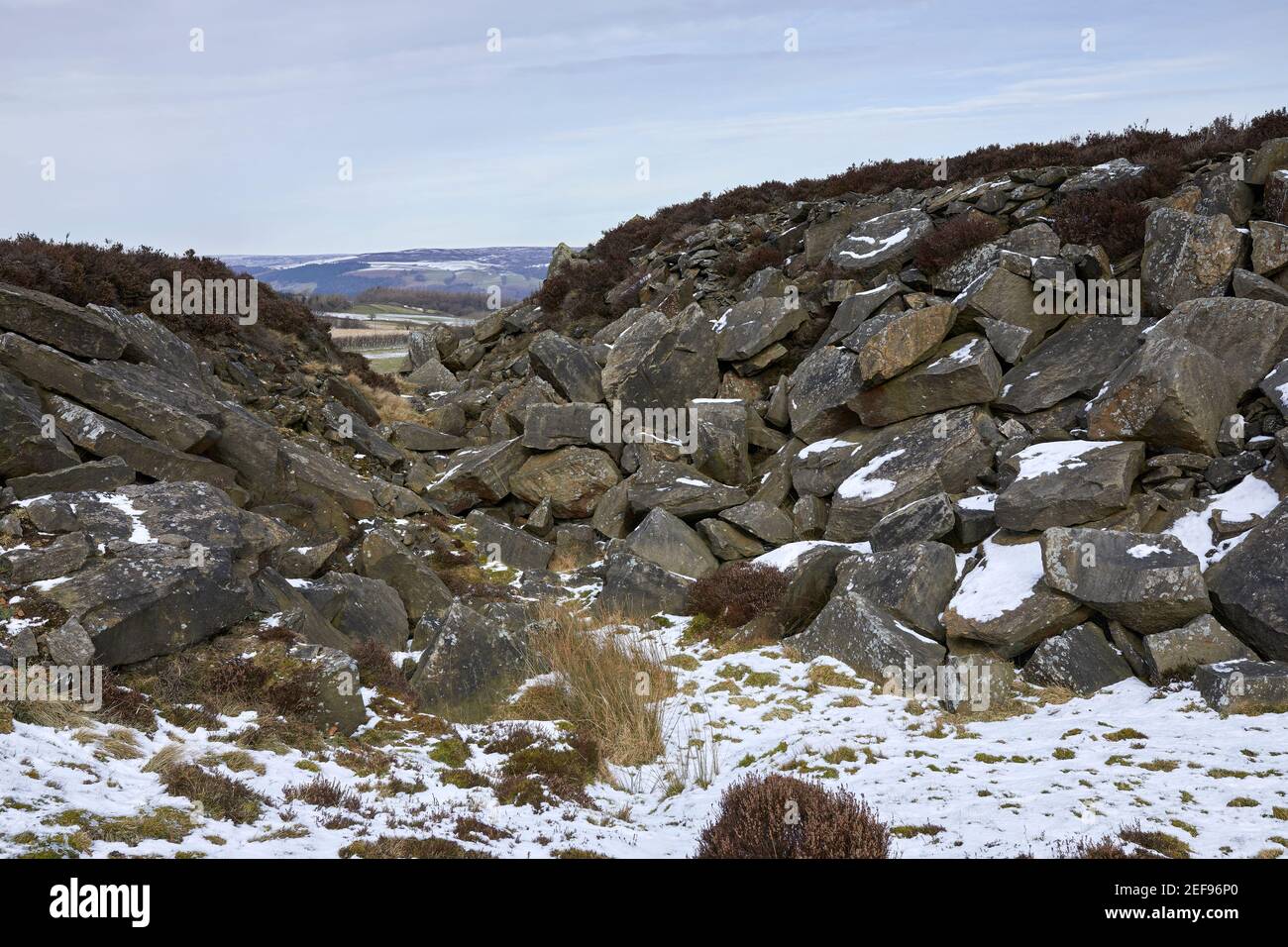 With tribute to the industrial past of Nidderdale, a view through discarded rocks and spoil heaps Stock Photo