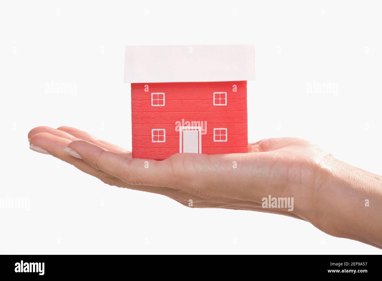 Model home on a palm of a woman Stock Photo - Alamy