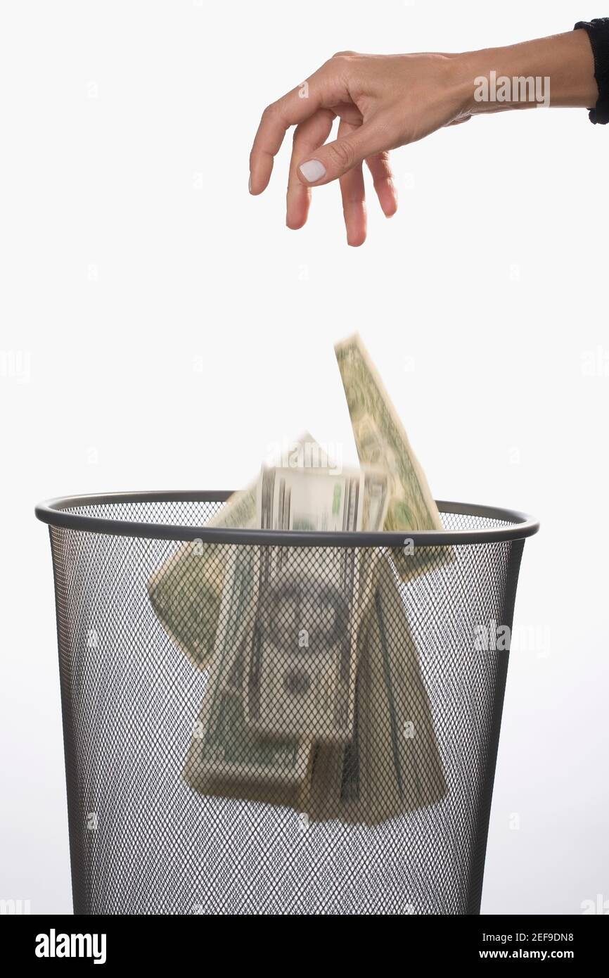 Throwing money down the drain hires stock photography and images Alamy
