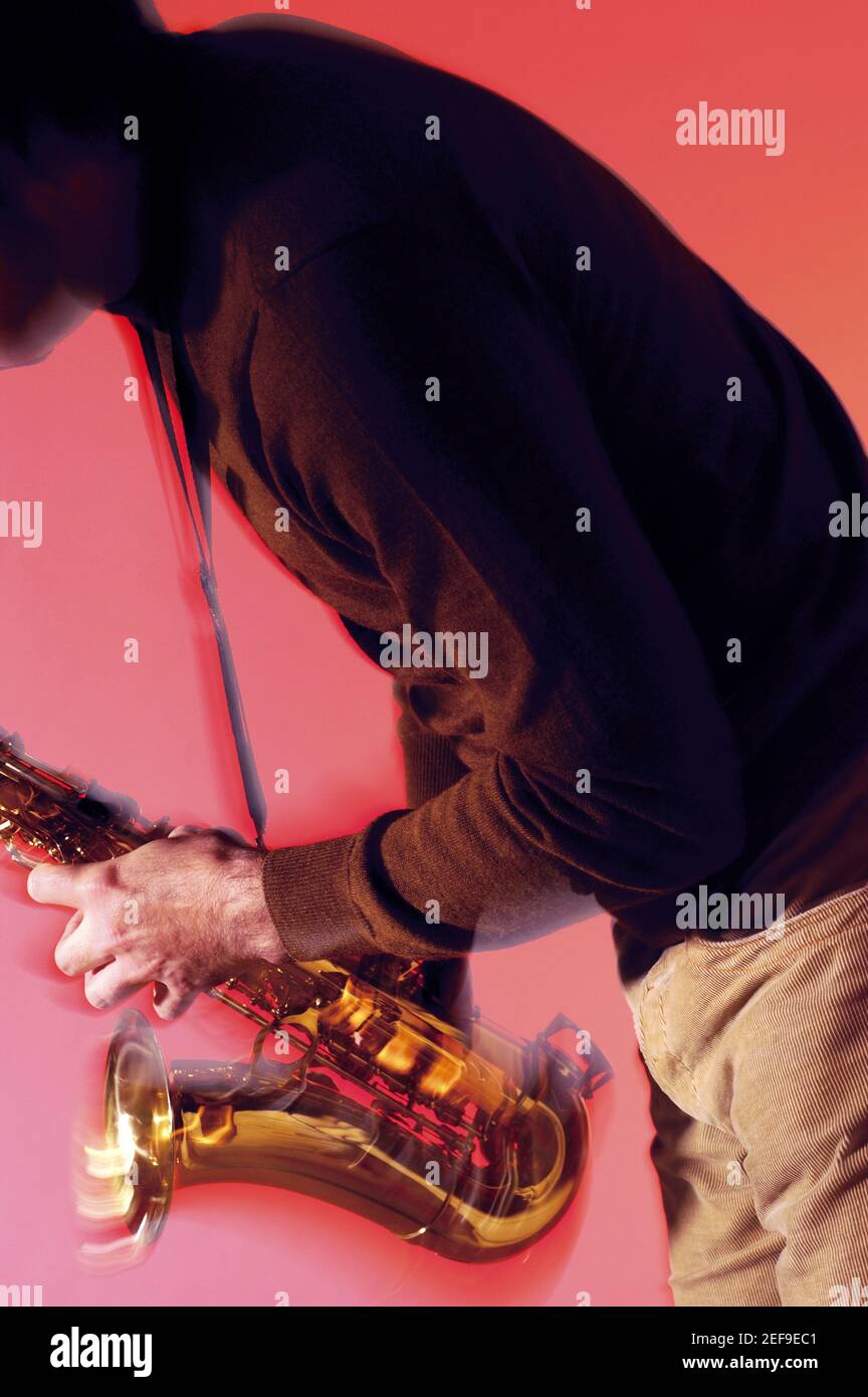 Mid section view of a musician playing the saxophone Stock Photo Alamy