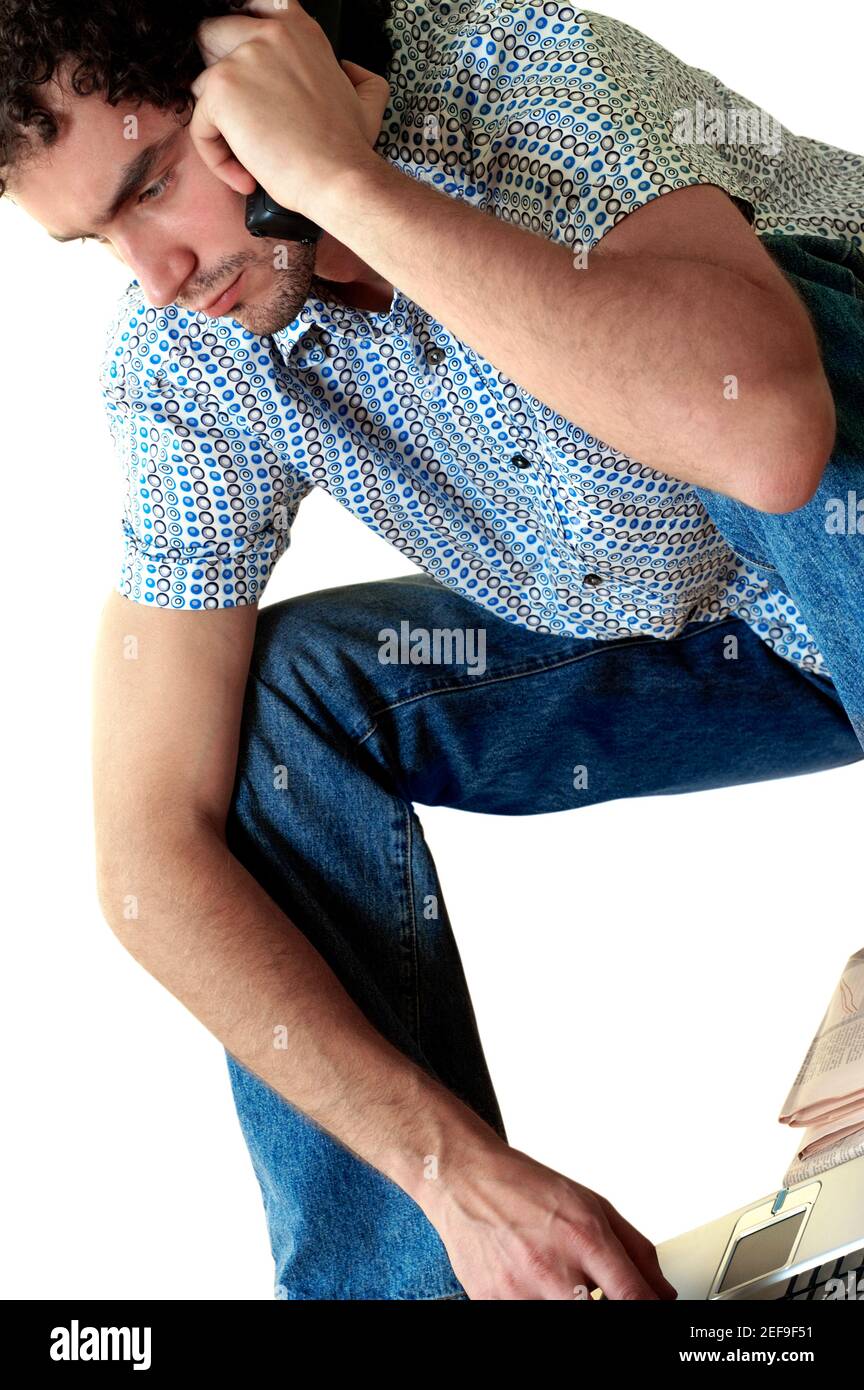 Close-up of a young man talking on a mobile phone Stock Photo