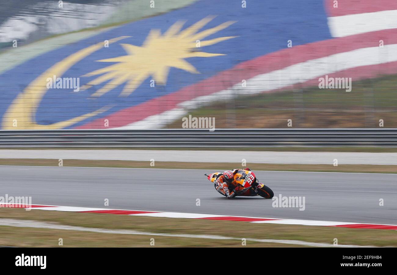 Honda MotoGP rider Marc Marquez of Spain rides past the Malaysian flag during the first free session of the Malaysian Motorcycle Grand Prix at Sepang International Circuit near Kuala Lumpur, Malaysia, October 23, 2015. REUTERS/Olivia Harris   Picture Supplied by Action Images Stock Photo