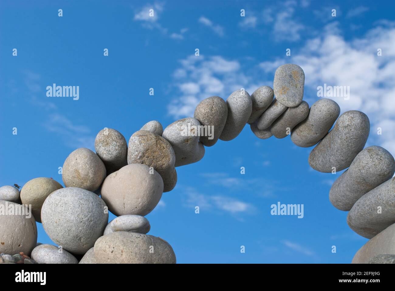 Low angle view of stones arranged in an arch shape Stock Photo