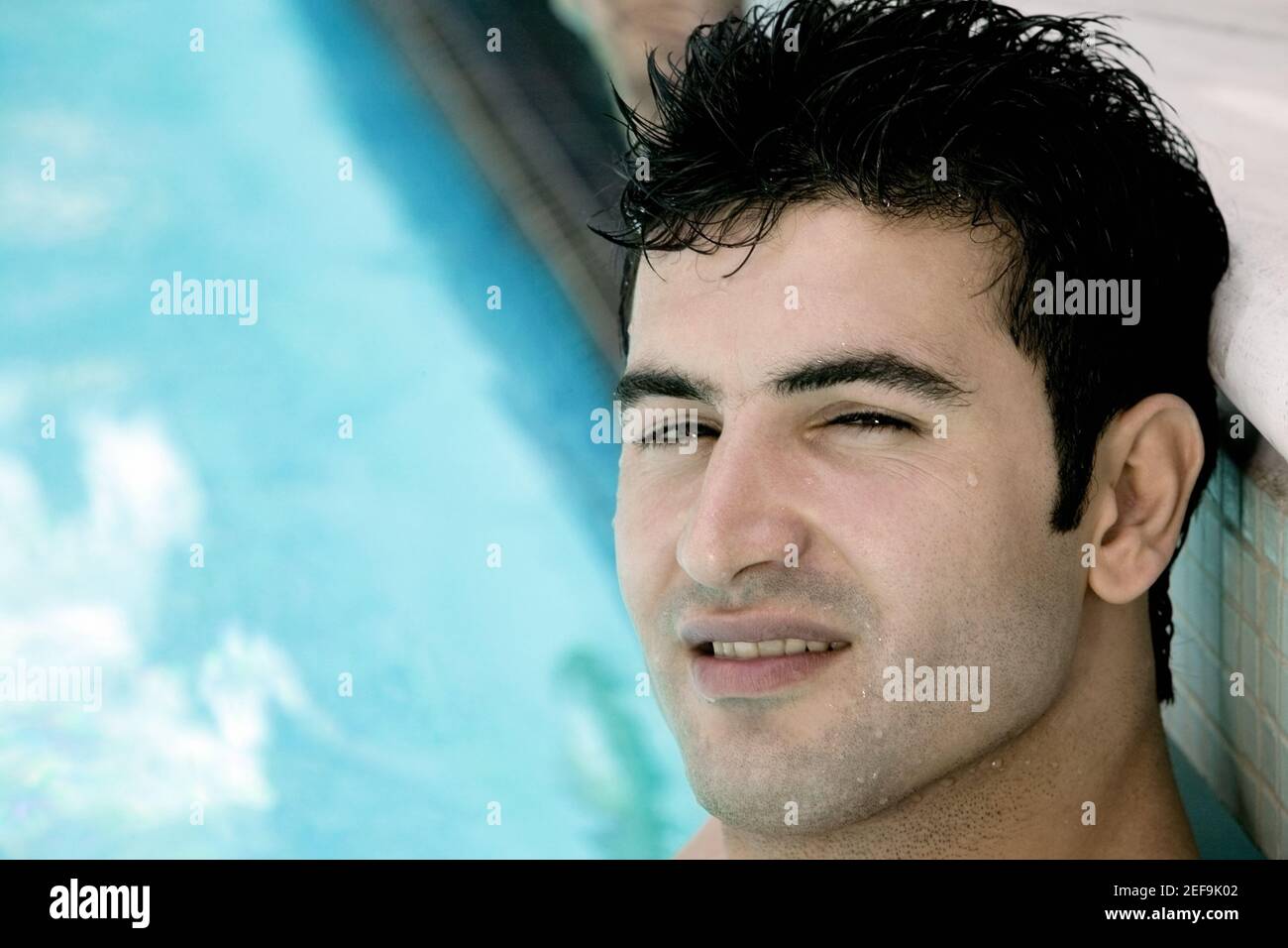 Portrait of a young man in a swimming pool Stock Photo - Alamy