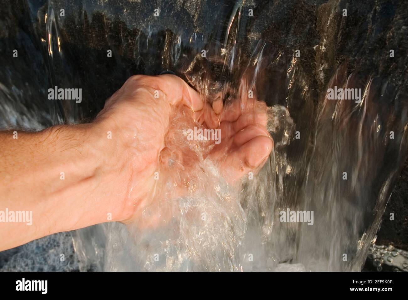 Close-up of a personÅ½s hand touching water Stock Photo