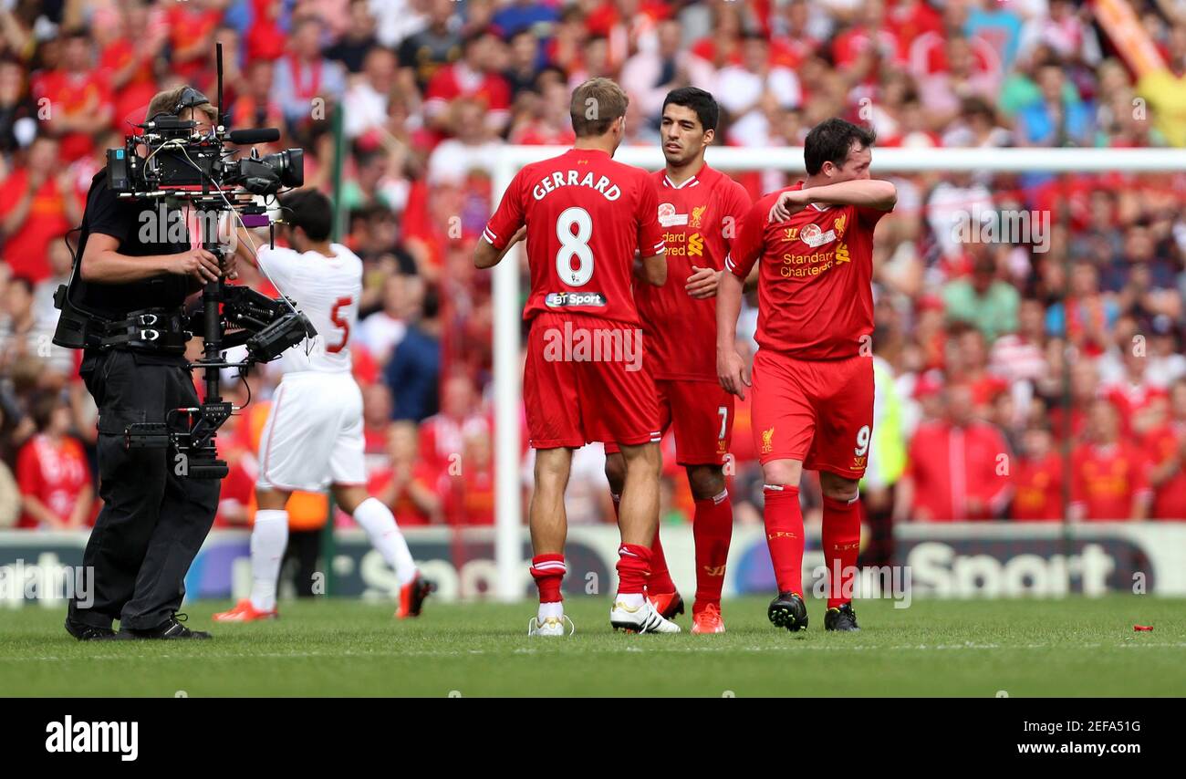 Football - Liverpool v Olympiakos - Steven Gerrard Testimonial - Pre Season  Friendly - Anfield - 3/8/13 Liverpool's Steven Gerrard embraces Luis Suarez  with Robbie Fowler (R) at the end of the