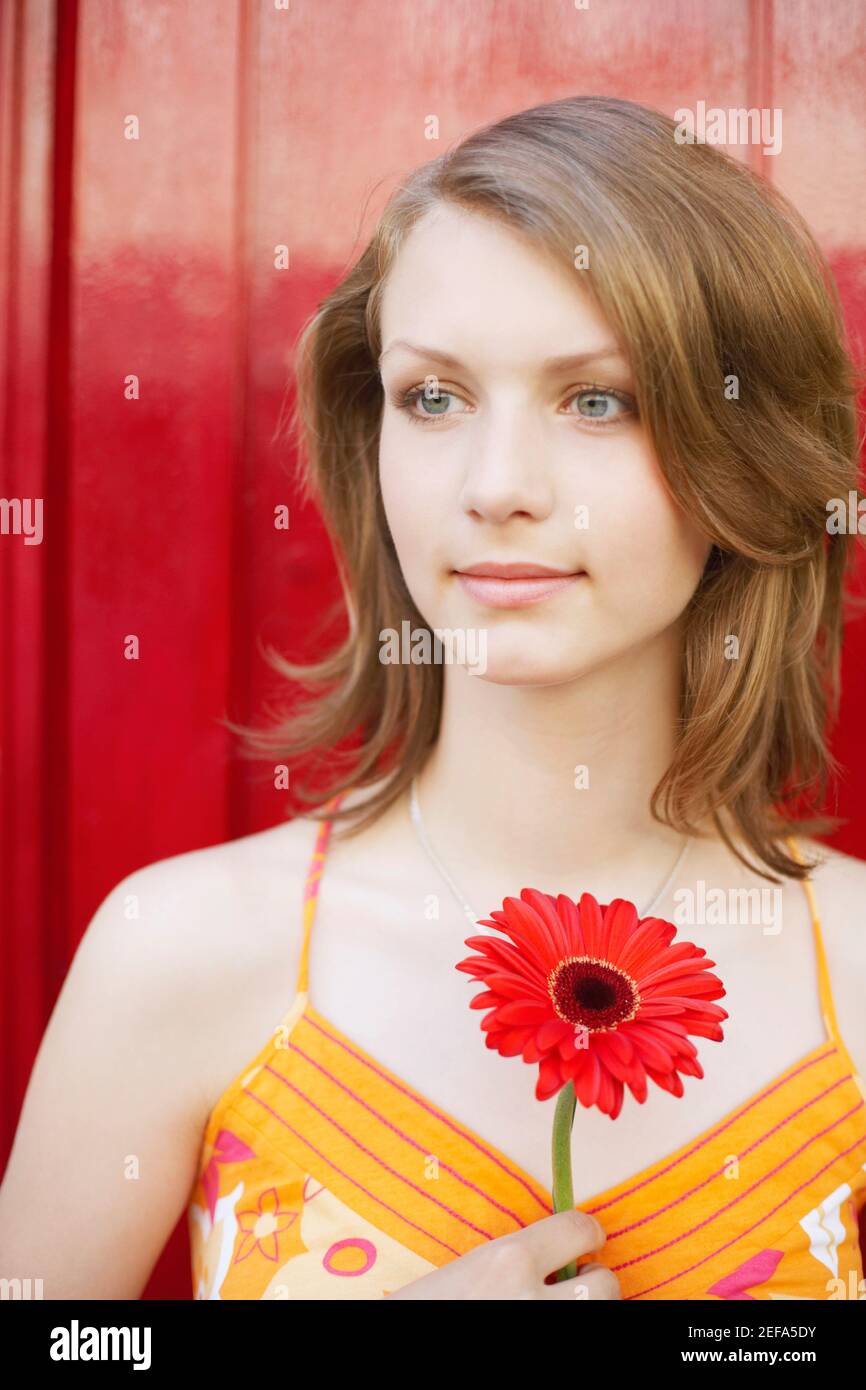 Close-up of a teenage girl holding a flower Stock Photo