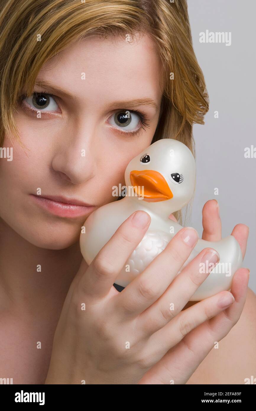Portrait of a teenage girl holding a rubber duck Stock Photo