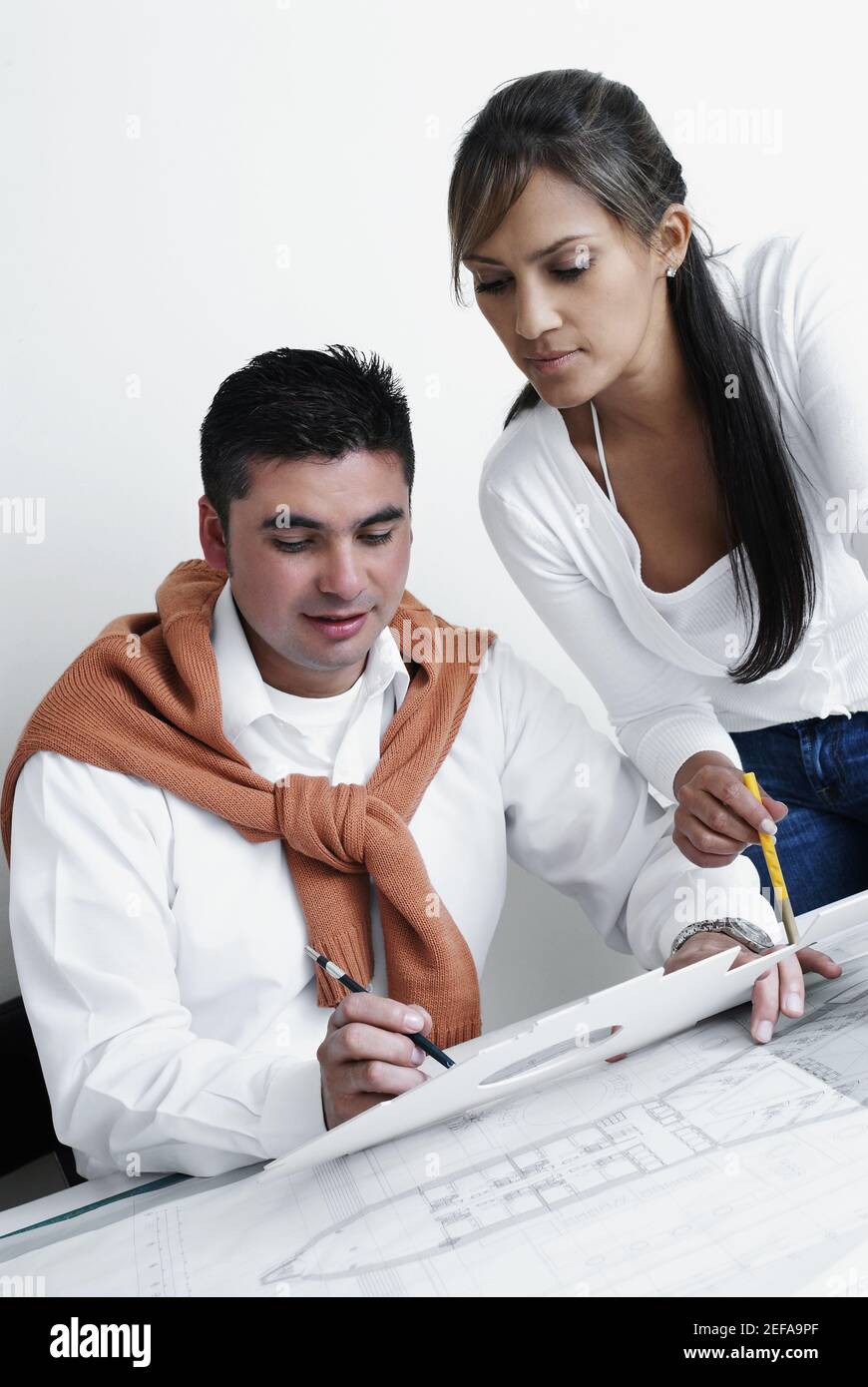 Two architects working on blueprints Stock Photo