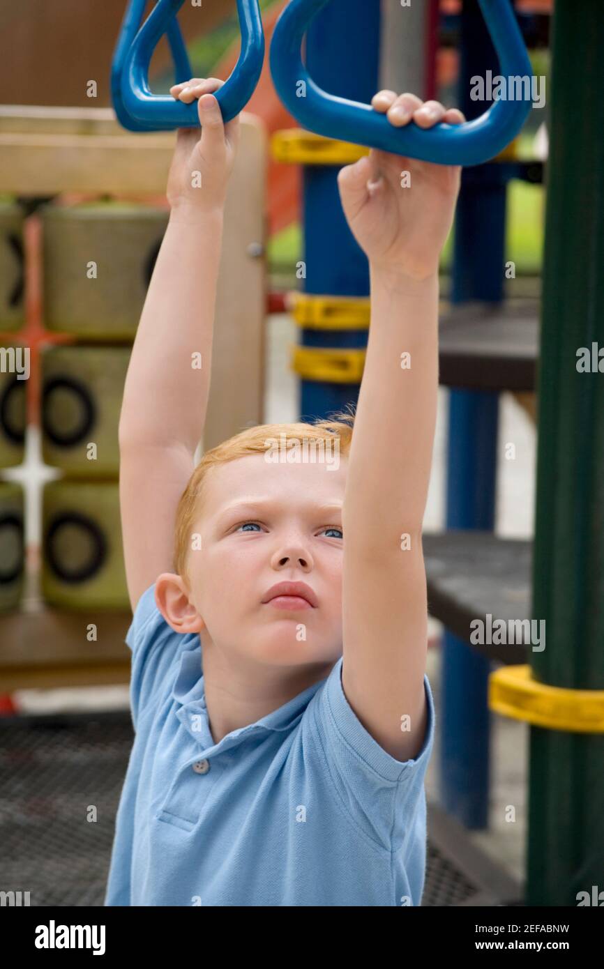 Hanging on monkey bars hires stock photography and images Alamy