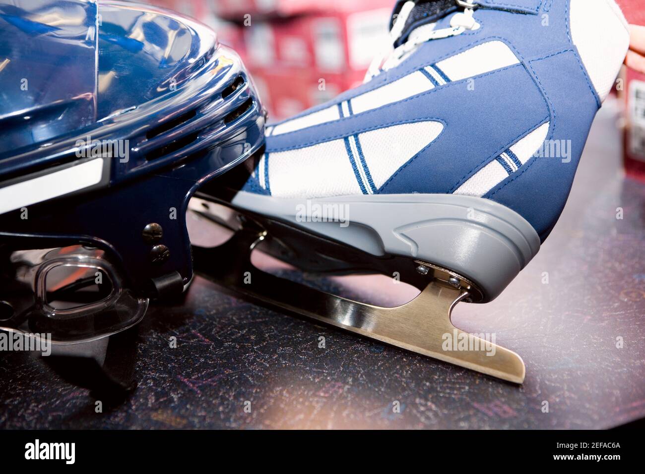 Closeup of a sports helmet with an iceskate Stock Photo Alamy