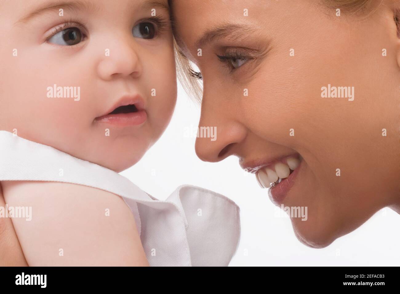 Close up of a mid adult woman smiling with her son Stock Photo