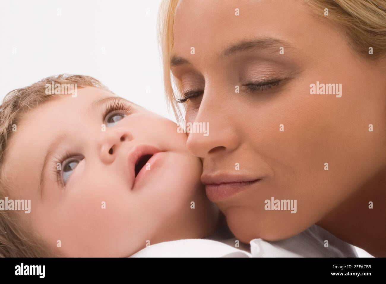 Close up of a mid adult woman loving her son Stock Photo
