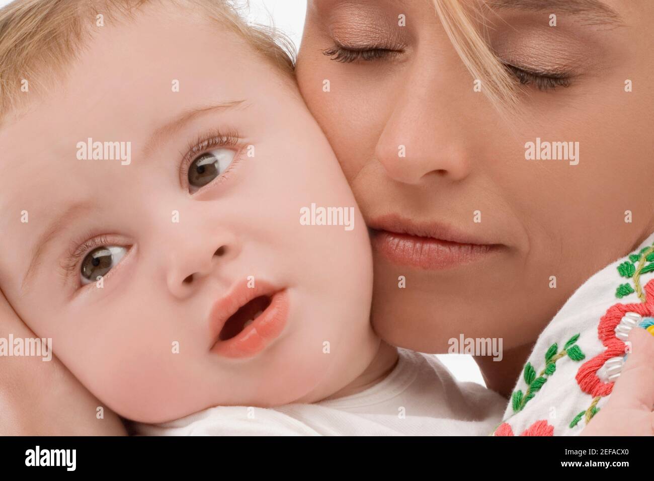 Close up of a mid adult woman loving her son Stock Photo