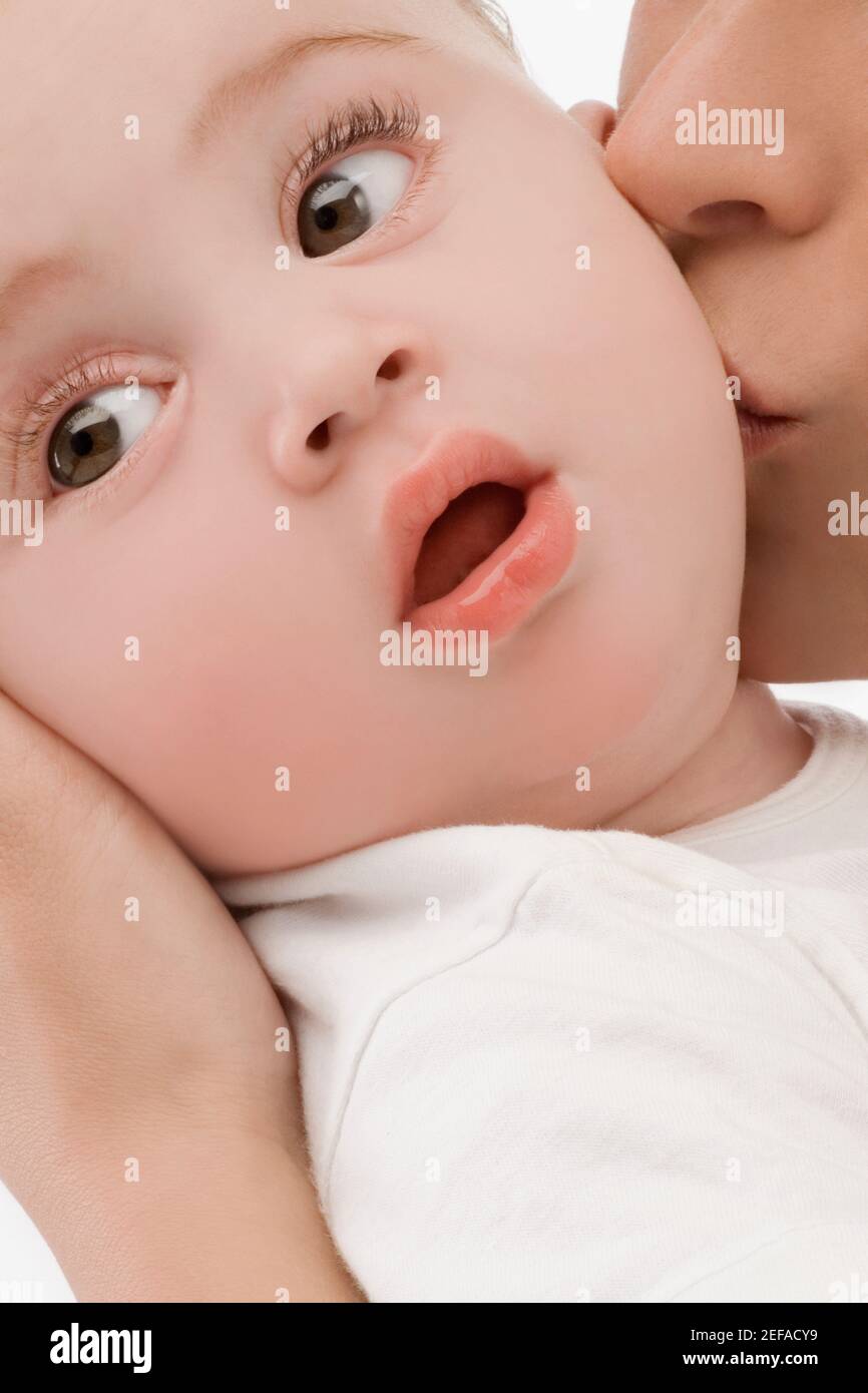 Close up of a mid adult woman kissing her son Stock Photo
