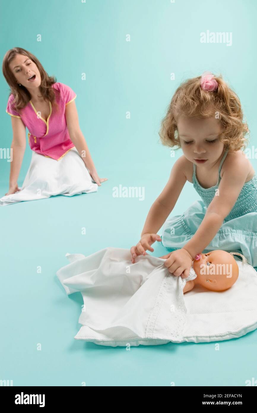 Close up of a girl playing with a doll Stock Photo