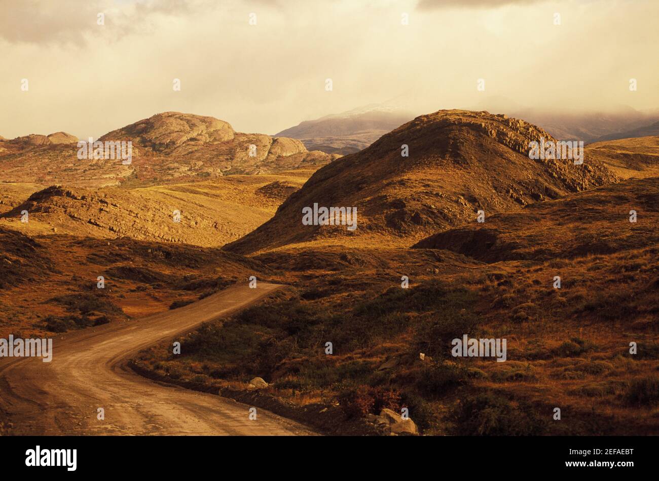 Dirt road through a landscape Stock Photo