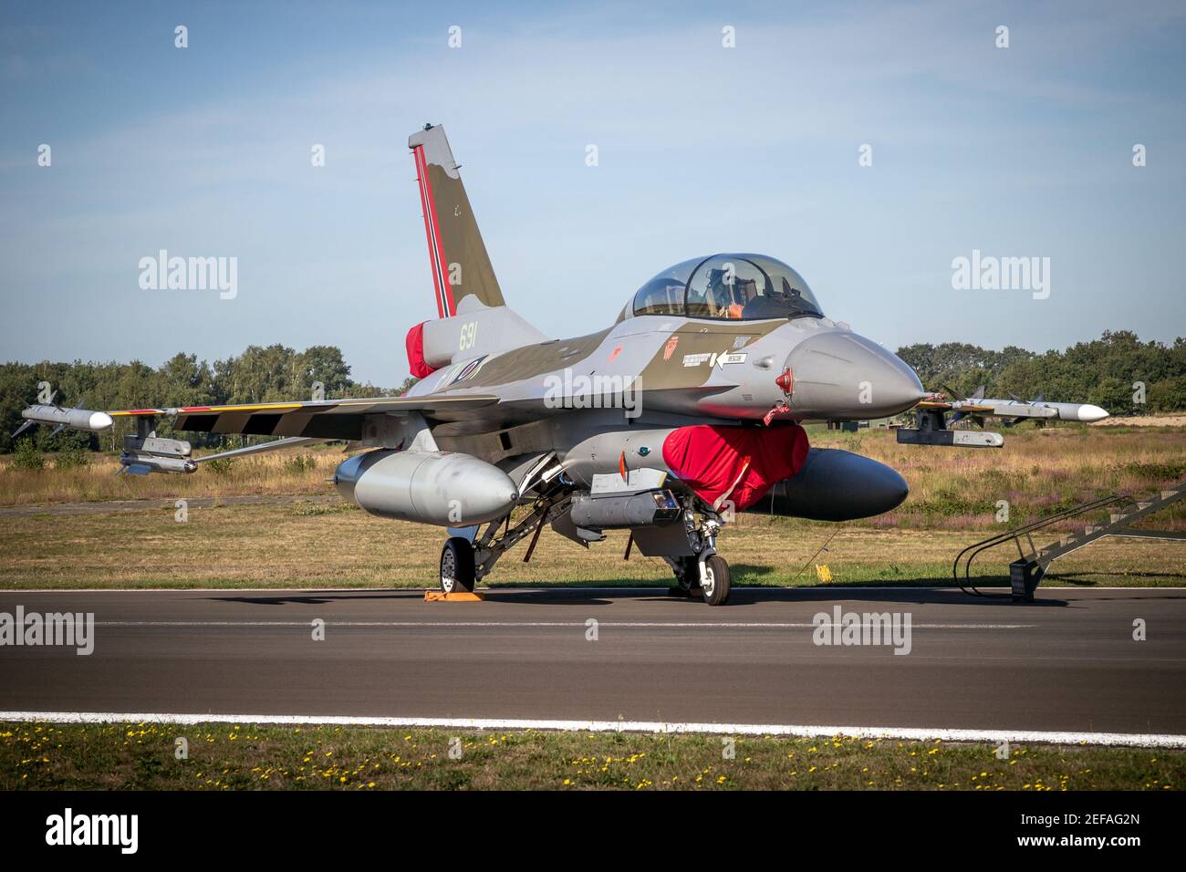 Royal Norwegian Air Force F-16 fighter aircraft in the colors of a World War 2 Spitfire fighter aircraft on the tarmac of Kleine-Brogel Airbase. Belgi Stock Photo
