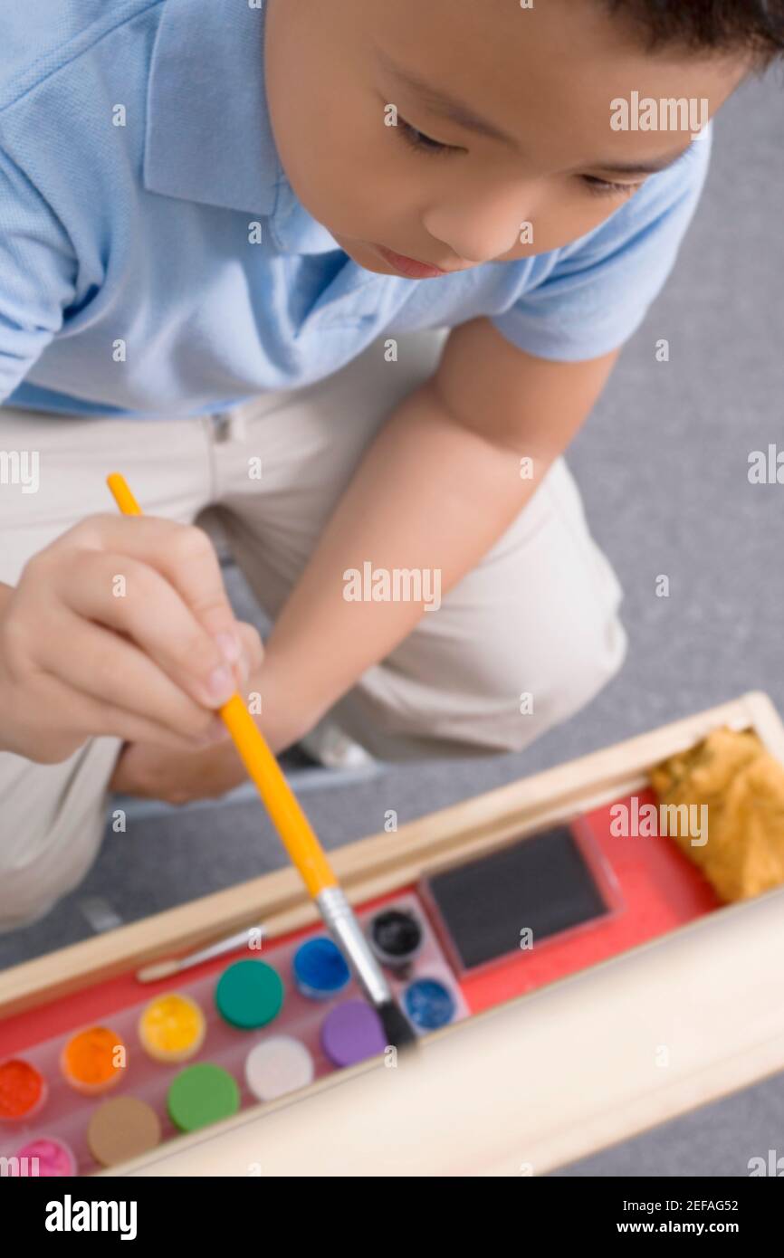 High angle view of a schoolboy painting in an art class Stock Photo - Alamy