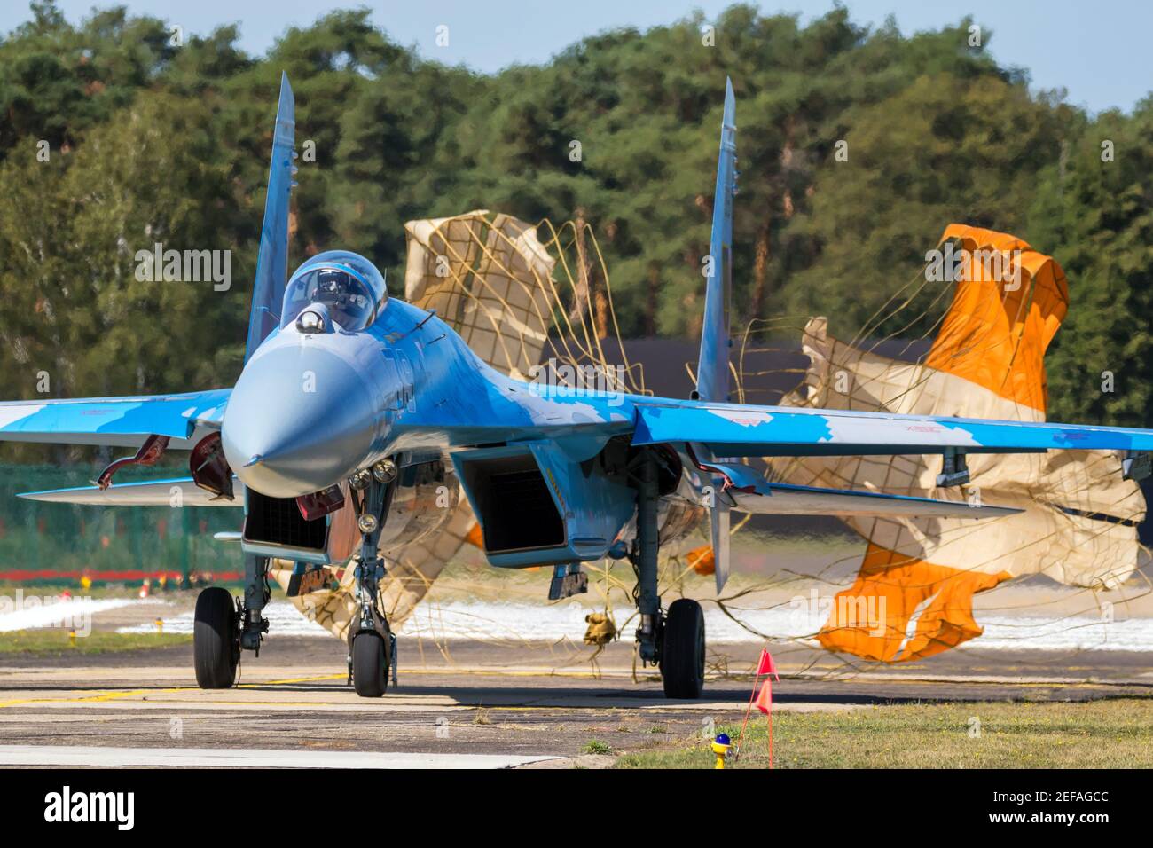 Ukrainian Air Force Sukhoi Su-27 Flanker fighter jet aircraft taxiing with brake parachute after landing on Kleine-Brogel Airbase. Belgium - September Stock Photo