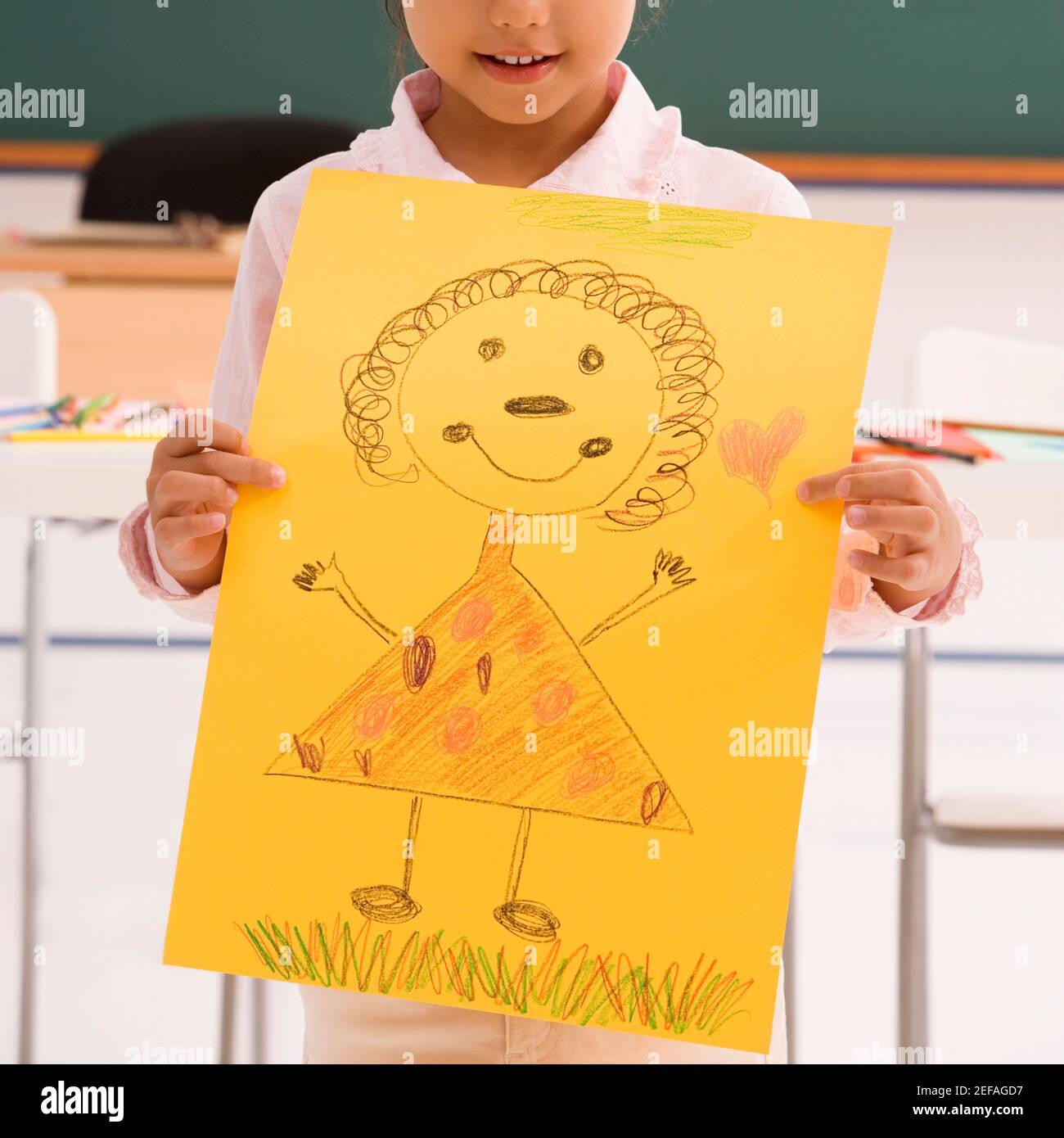 Close up of a schoolgirl showing her drawing and smiling Stock Photo ...