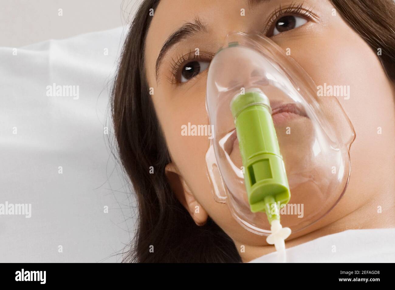 Young woman wearing oxygen mask hires stock photography and images Alamy