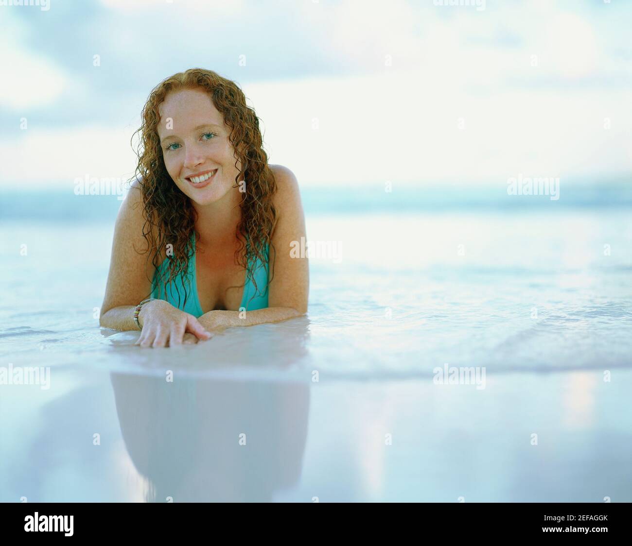 Portrait of a young woman smiling on the beach, Bermuda Stock Photo - Alamy