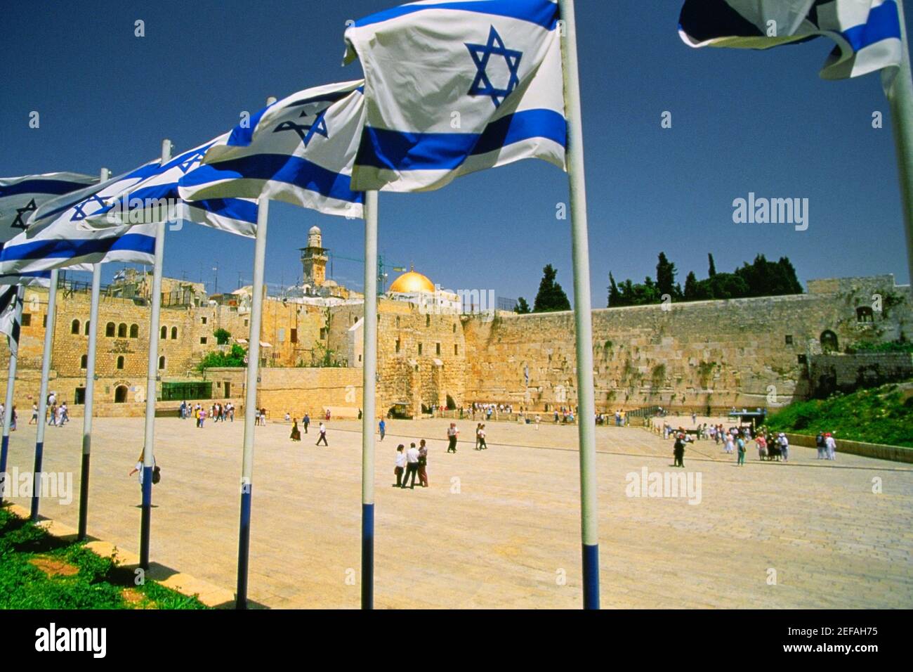 Israeli flags at a shrine and a dome in the background, Wailing Wall