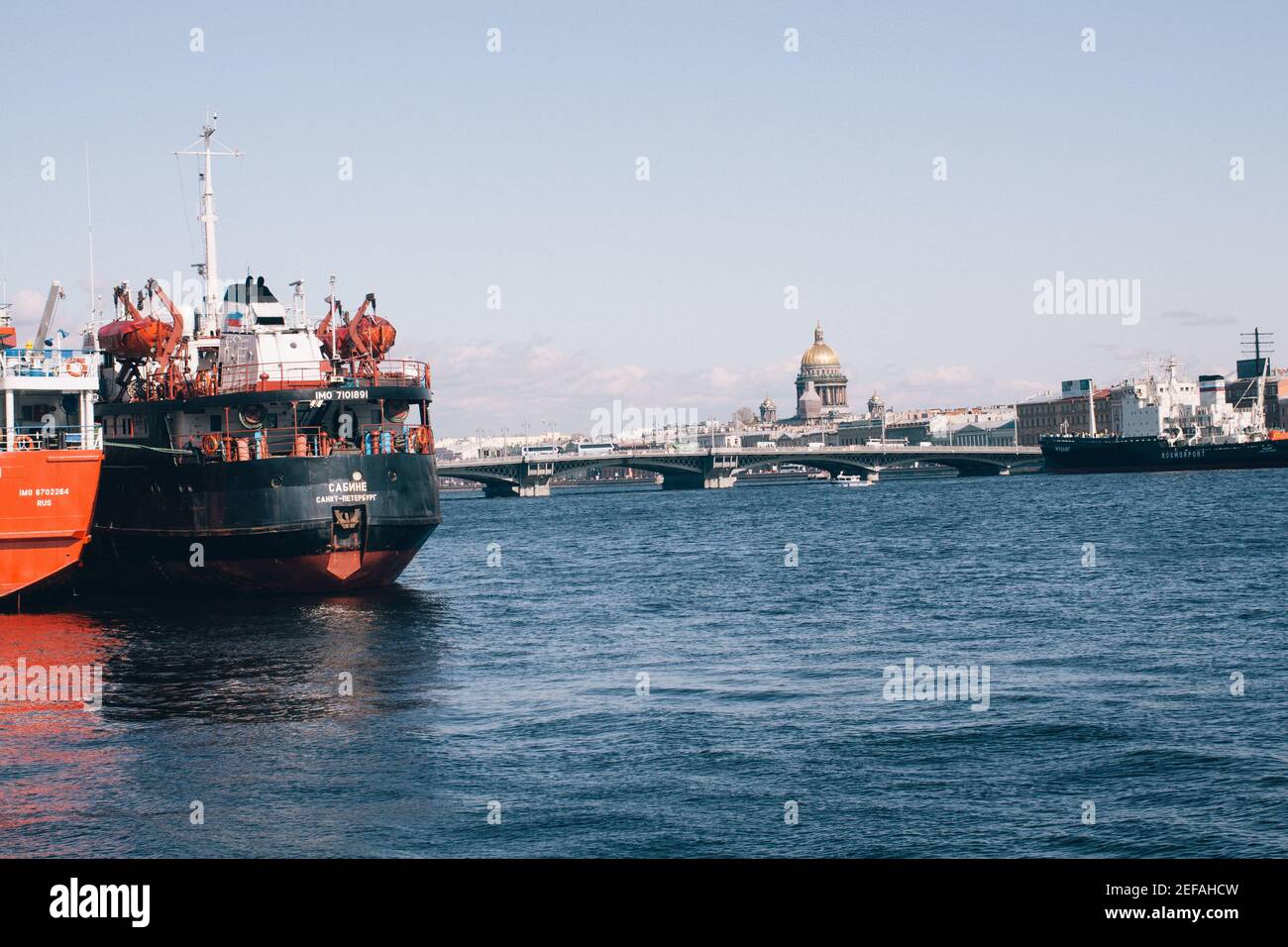SAINT PETERSBURG, RUSSIA - May 01, 2019: Military Ships staying in the sea bay near the bridge and cathedrals, Saint Petersburg, Russia Stock Photo
