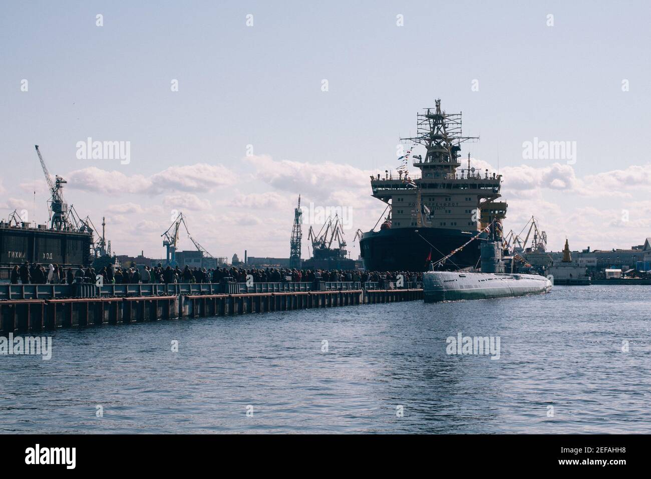 SAINT PETERSBURG, RUSSIA - May 01, 2019: The sea port of Saint Petersburg with containers, old vessels and equipment in the bay, Russia Stock Photo