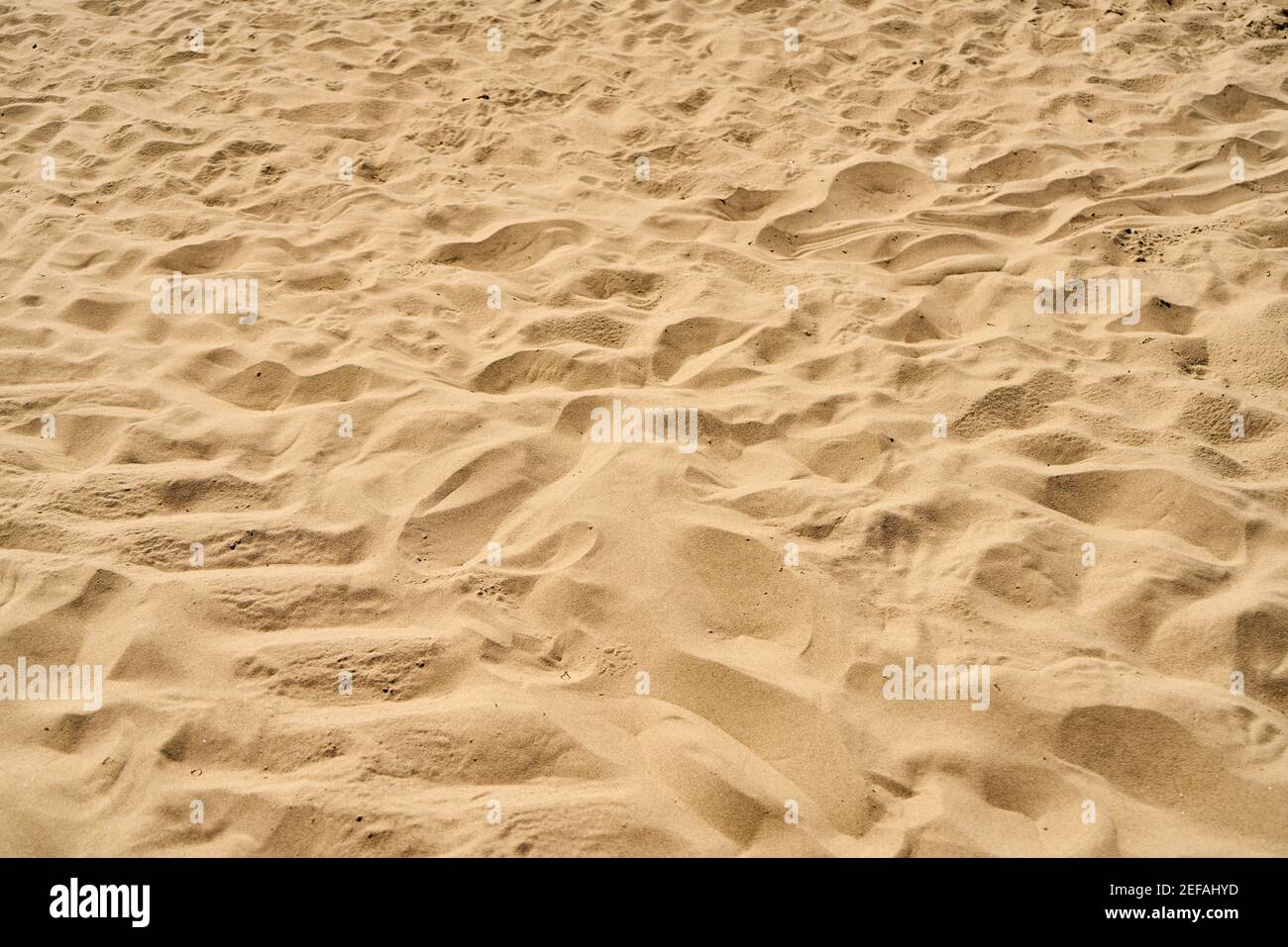 Yellow sand beach texture as landscape background pattern Stock Photo