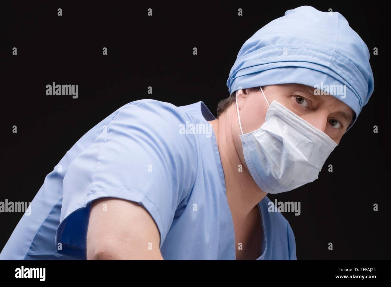 Close up of a male surgeon wearing scrubs and a surgical mask Stock ...