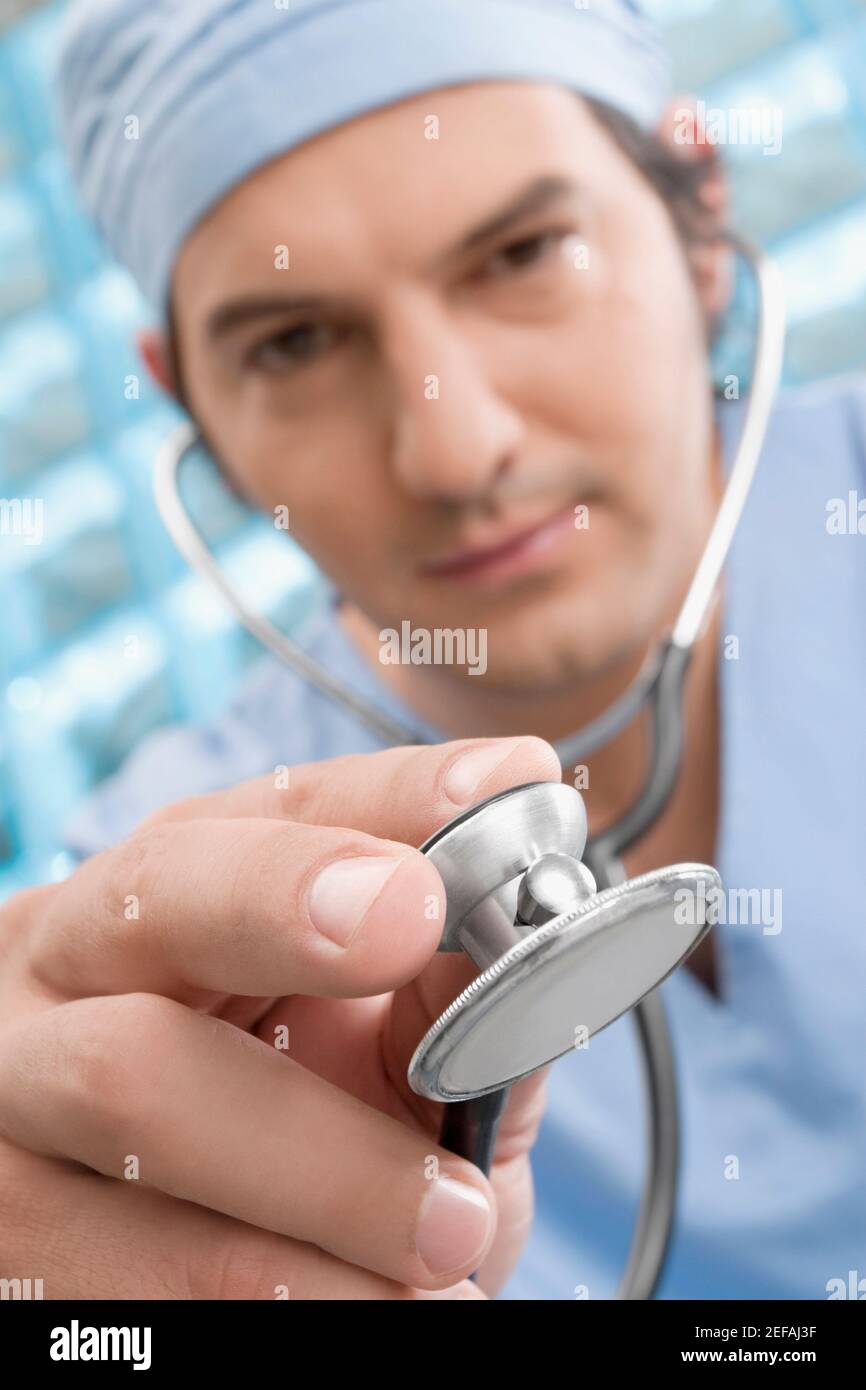 Male surgeon holding a stethoscope Stock Photo - Alamy